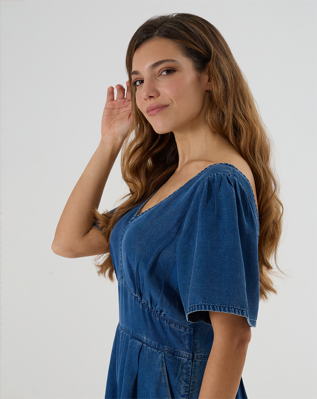 Tuta corta in denim con punto smock