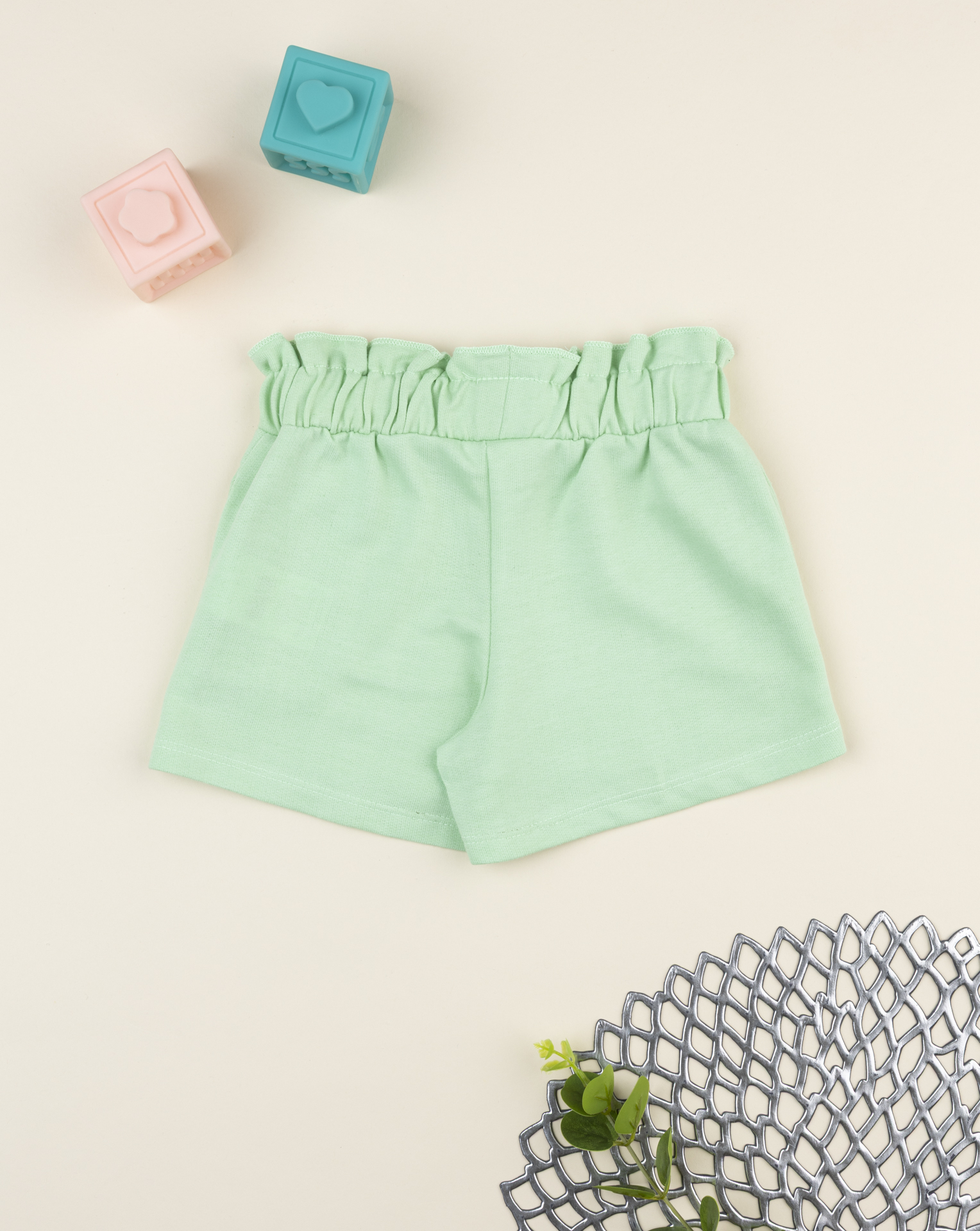 Shorts bimba verde con stampa