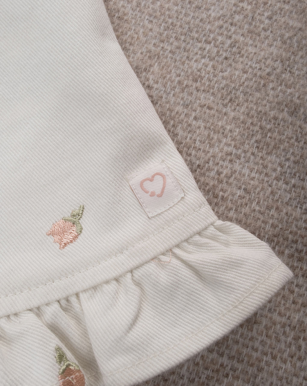 Salopette bimba panna con tulipani