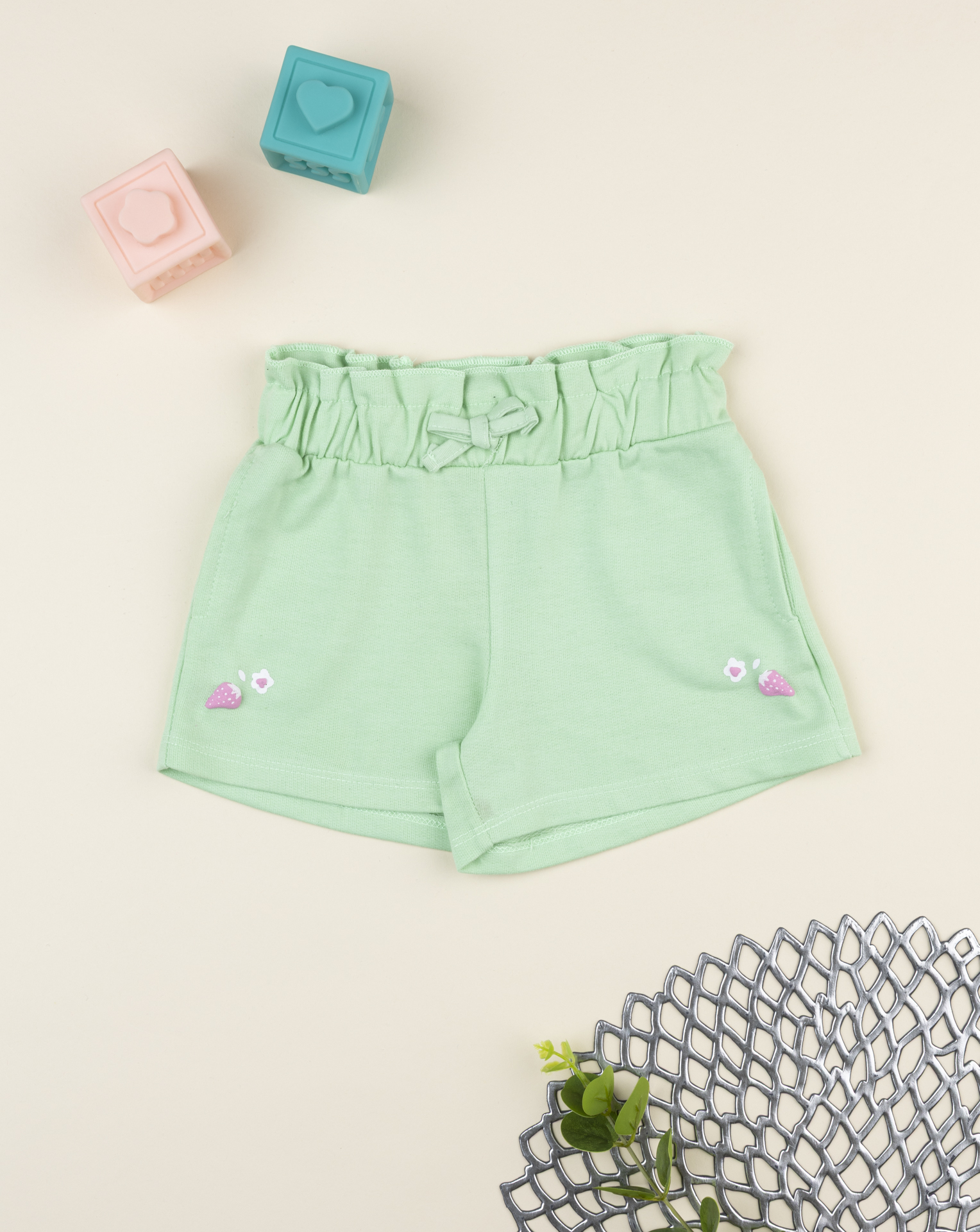 Shorts bimba verde con stampa