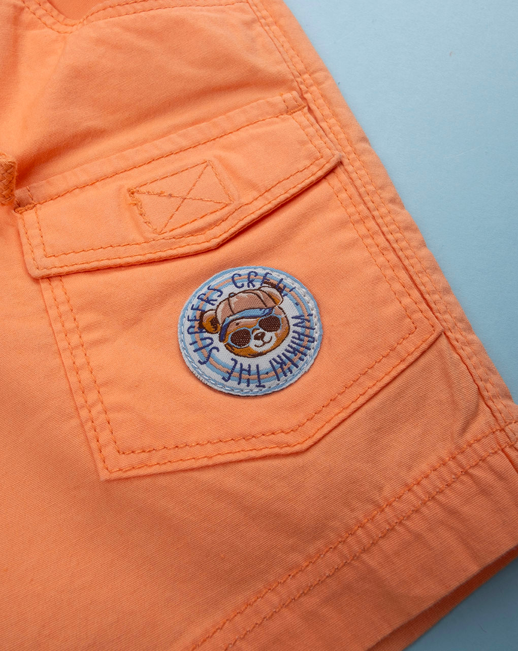 Shorts bimbo arancioni tasconi