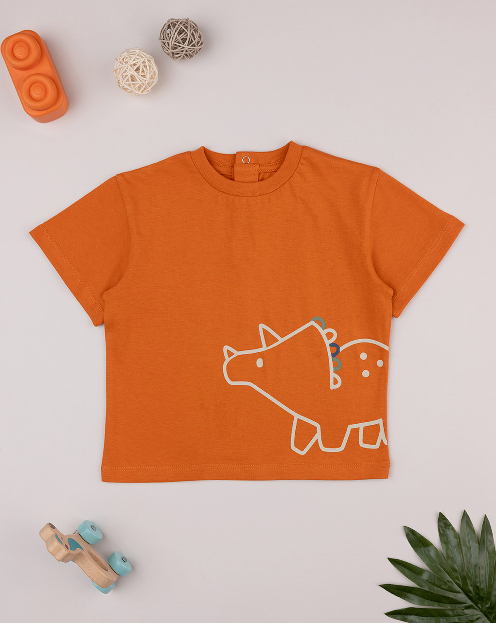 T-shirt bimbo arancione stampa triceratopo