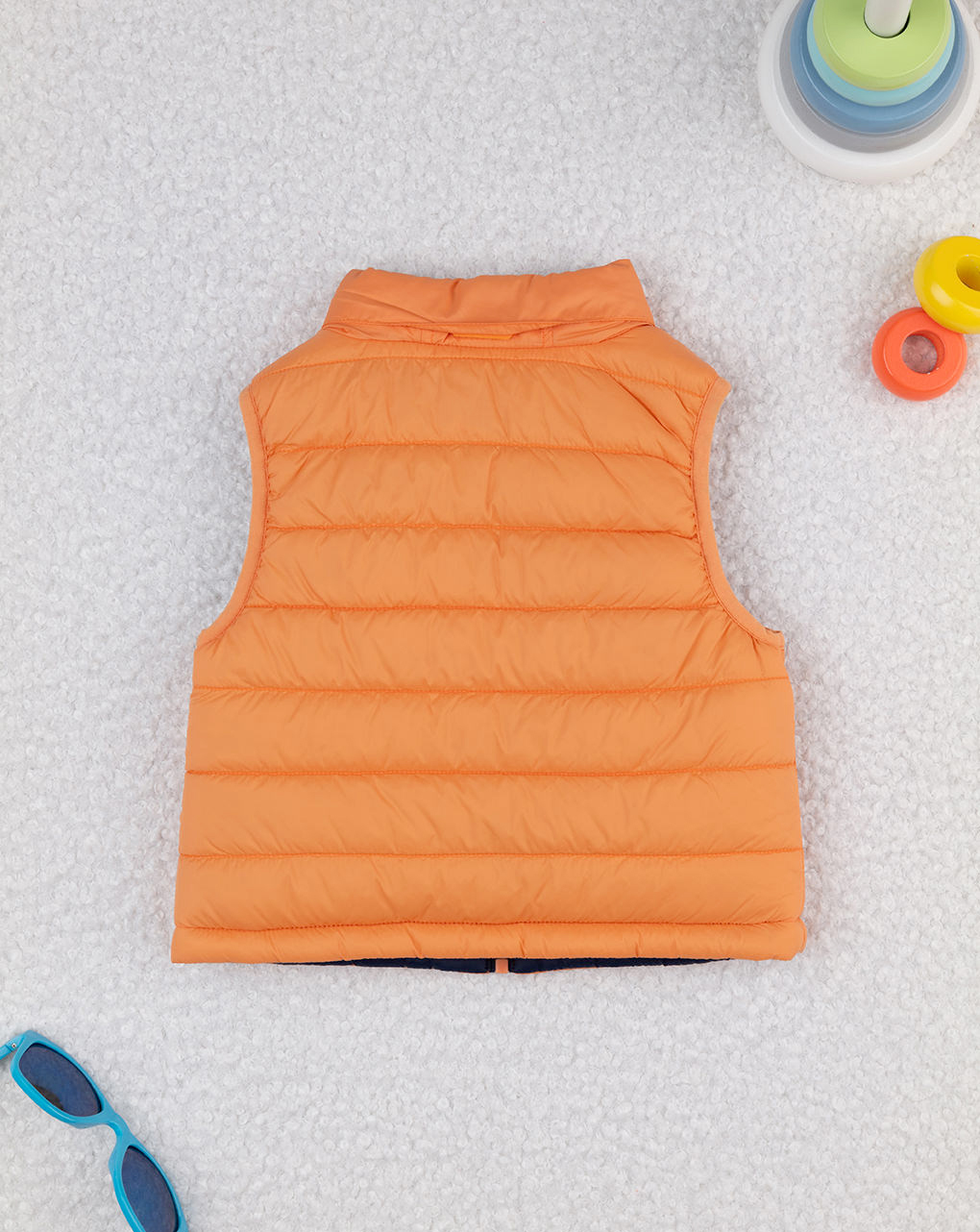Piumino smanicato bimbo arancione