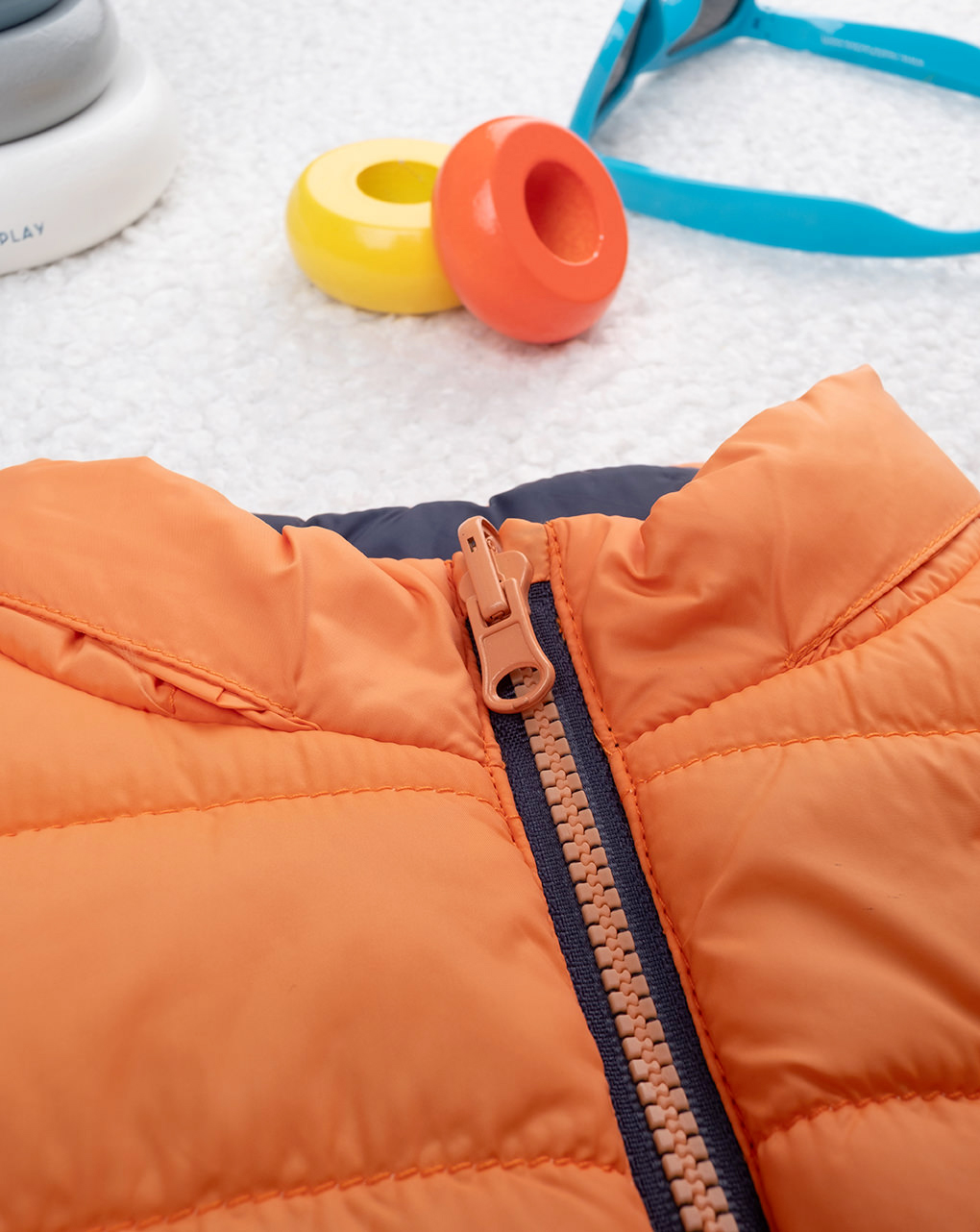 Piumino smanicato bimbo arancione