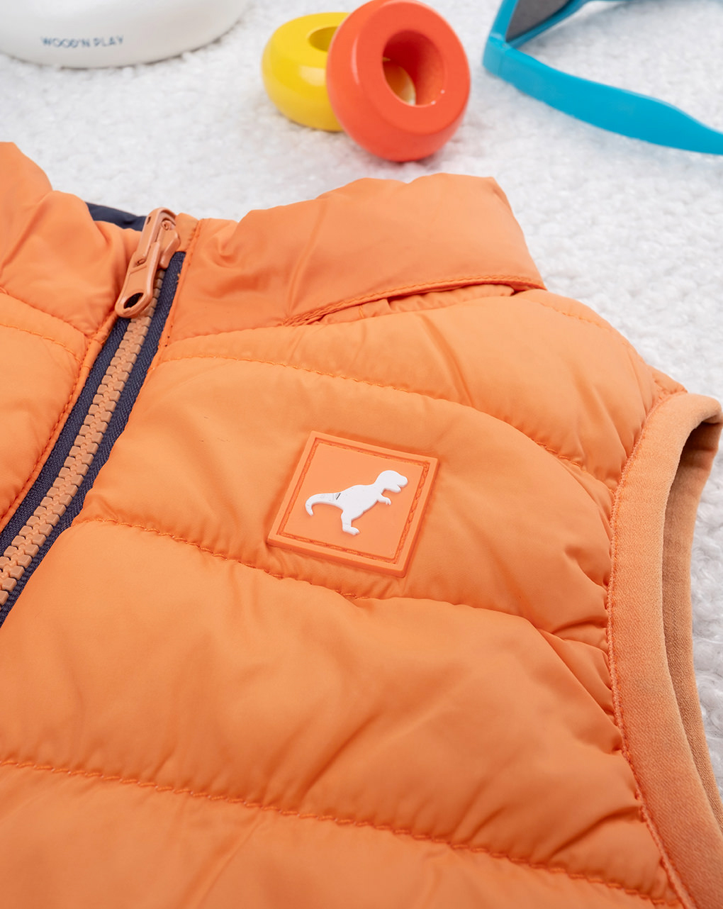 Piumino smanicato bimbo arancione