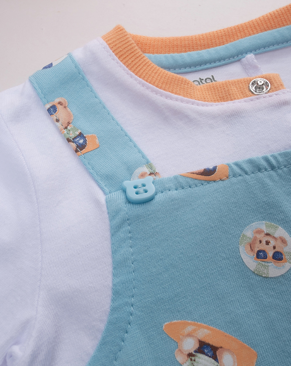 Pagliaccetto bimbo azzurro/bianco con stampa allover