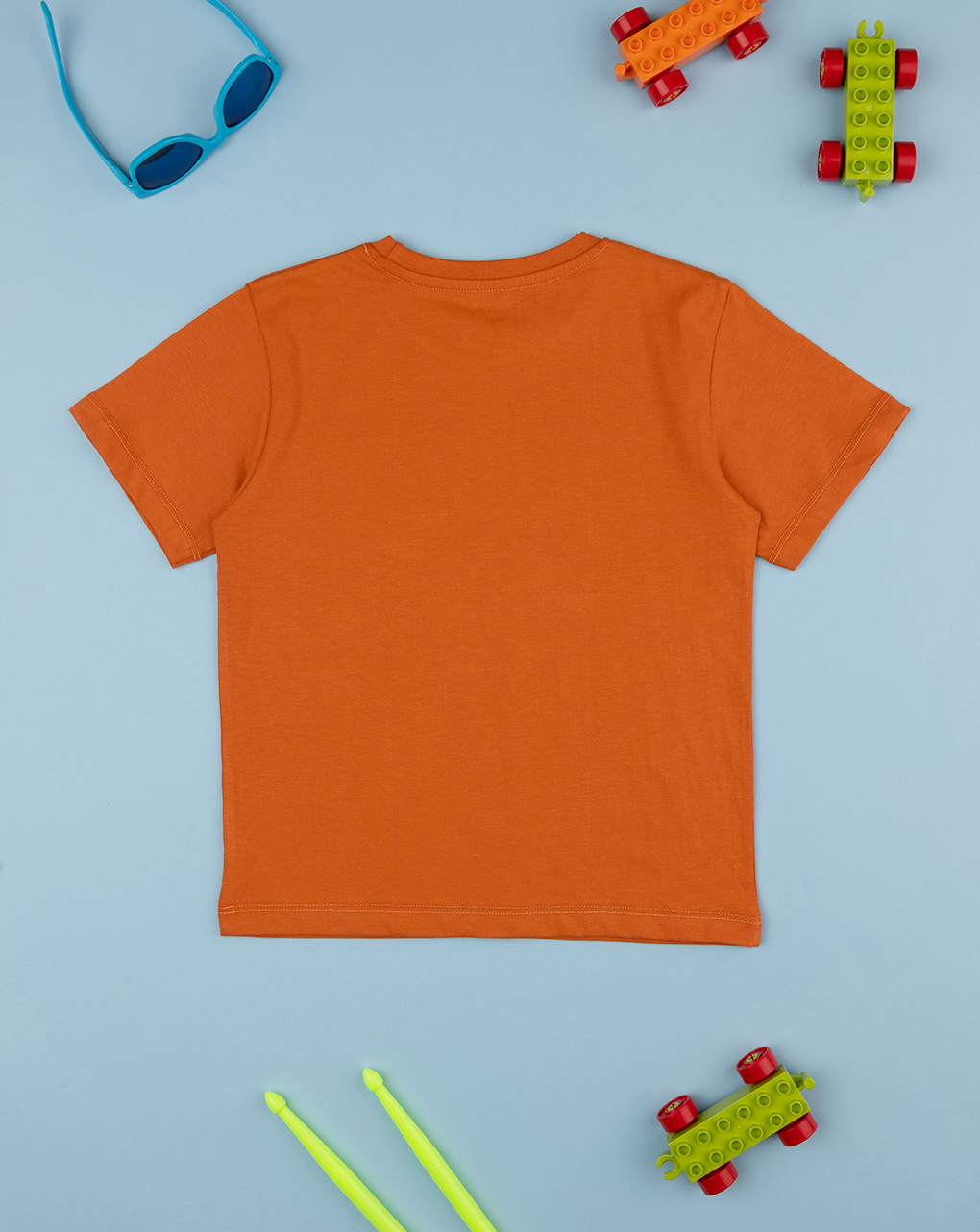 T-shirt bimbo arancione stampata dinosauri