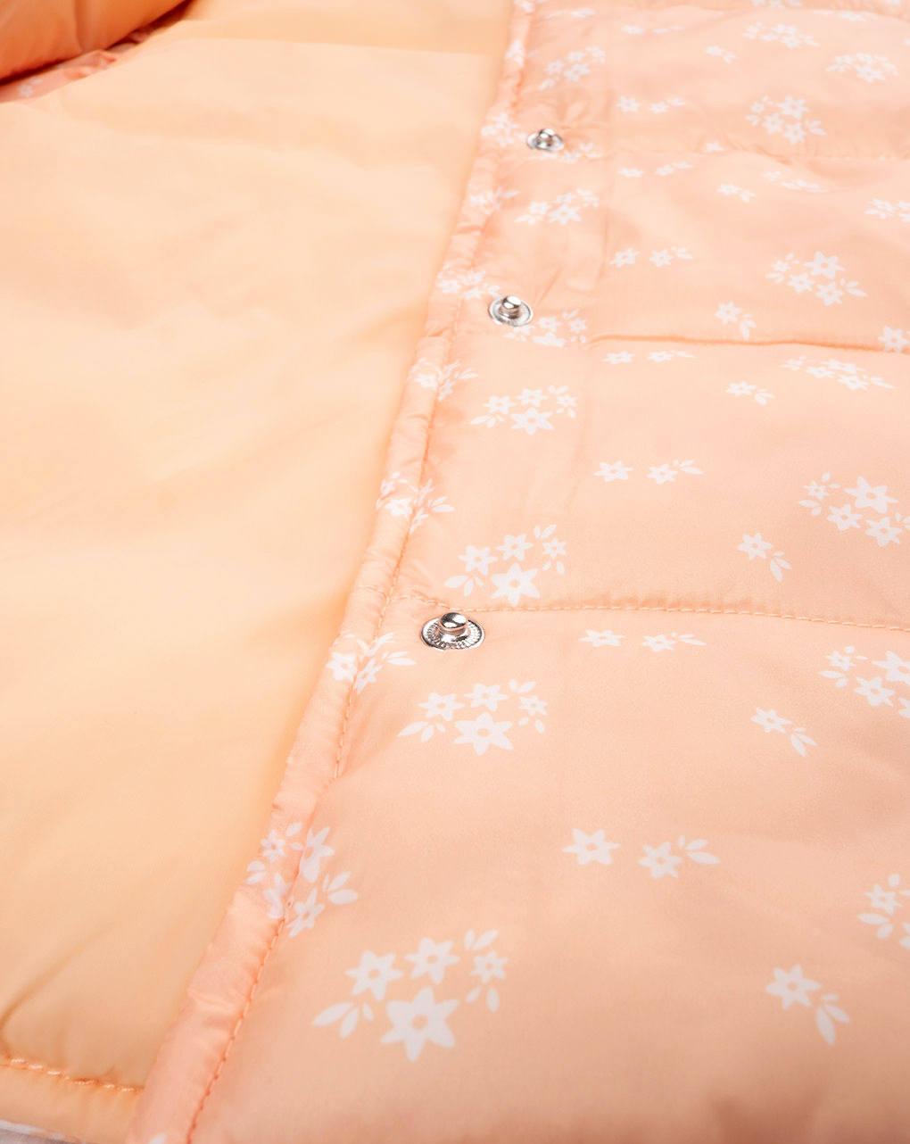 Piumino smanicato bimba arancione