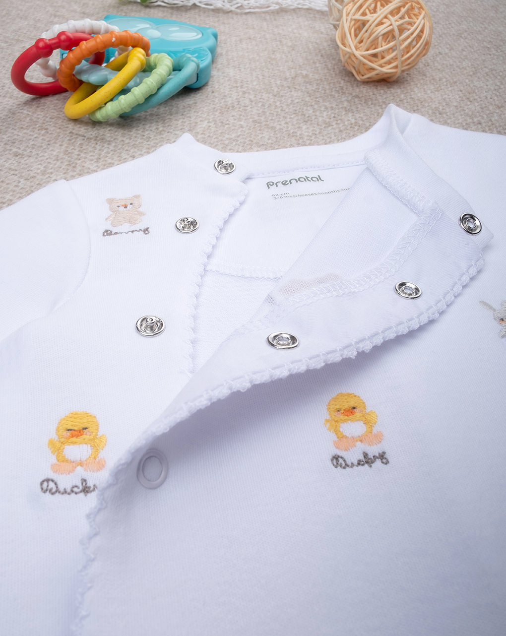 Tutina unisex smile ricami allover