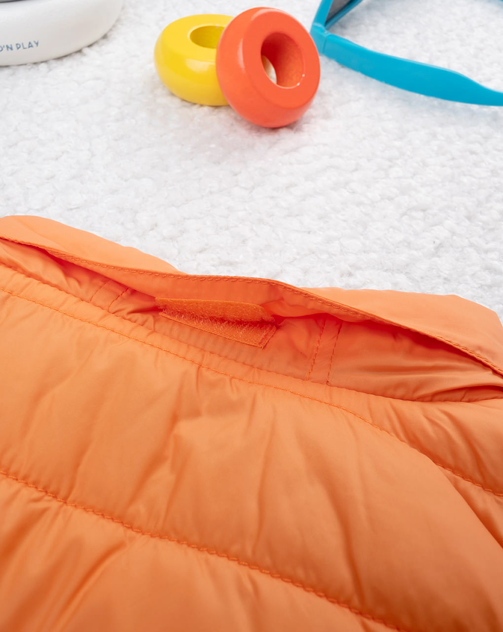 Piumino smanicato bimbo arancione