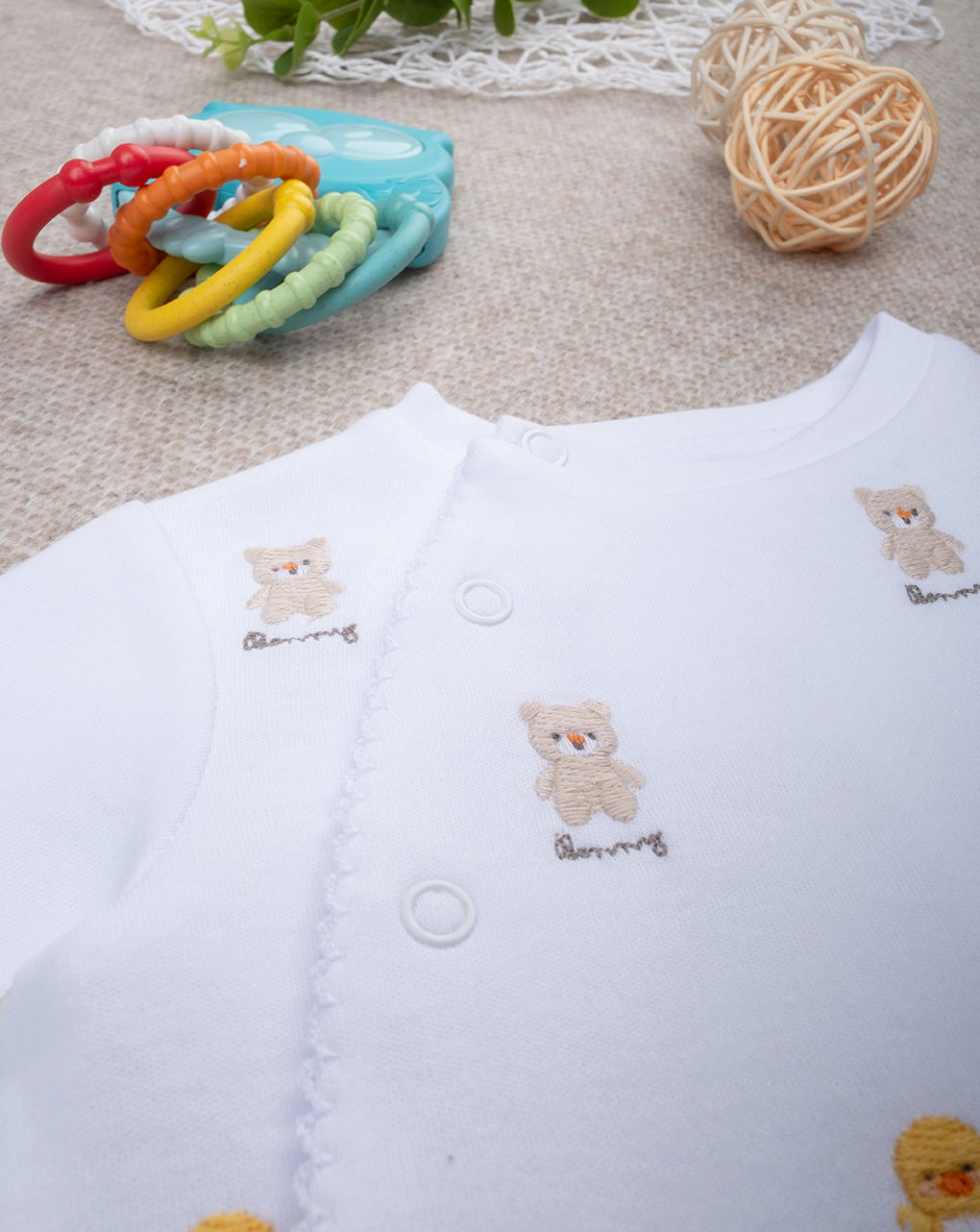 Tutina unisex smile ricami allover