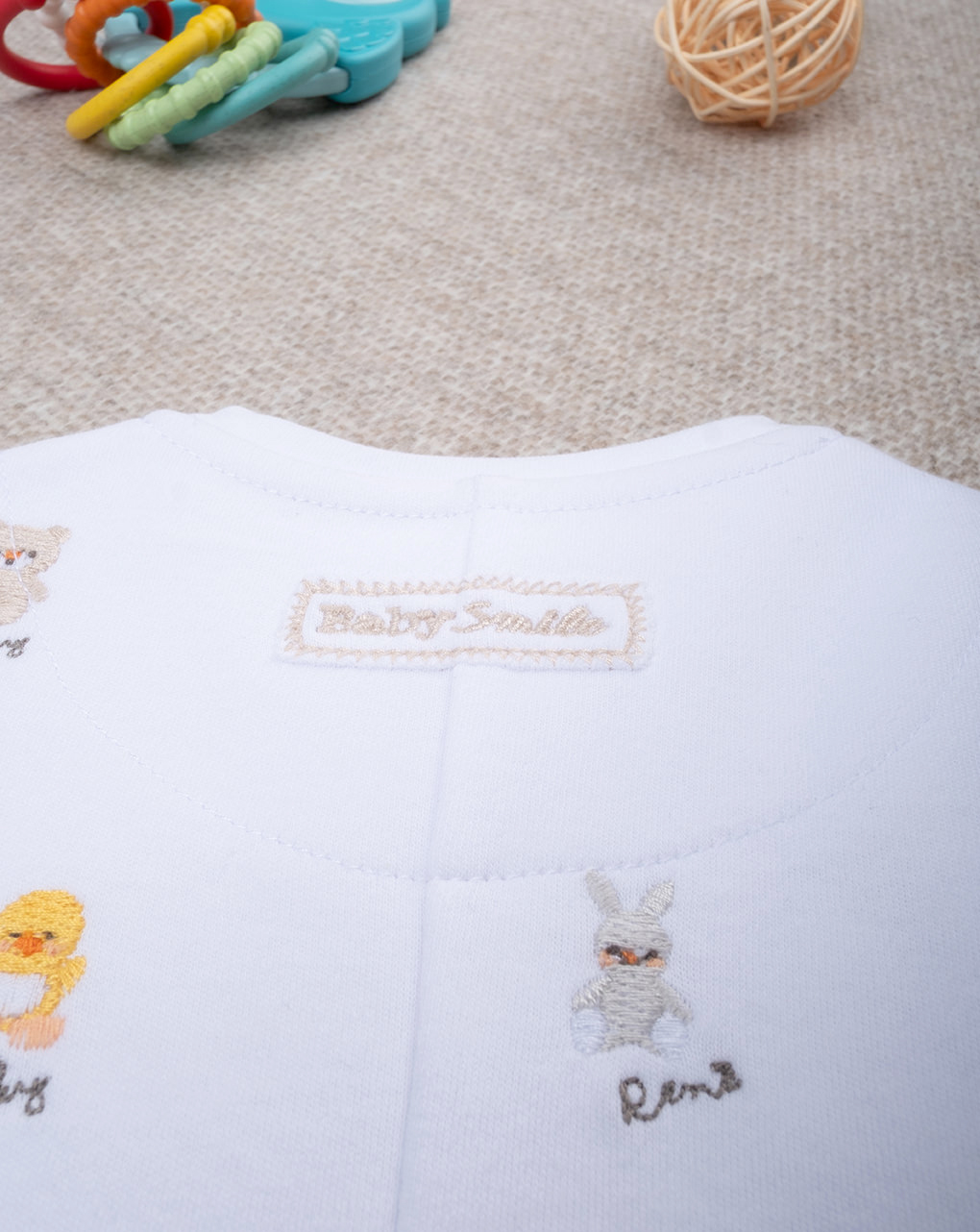 Tutina unisex smile ricami allover