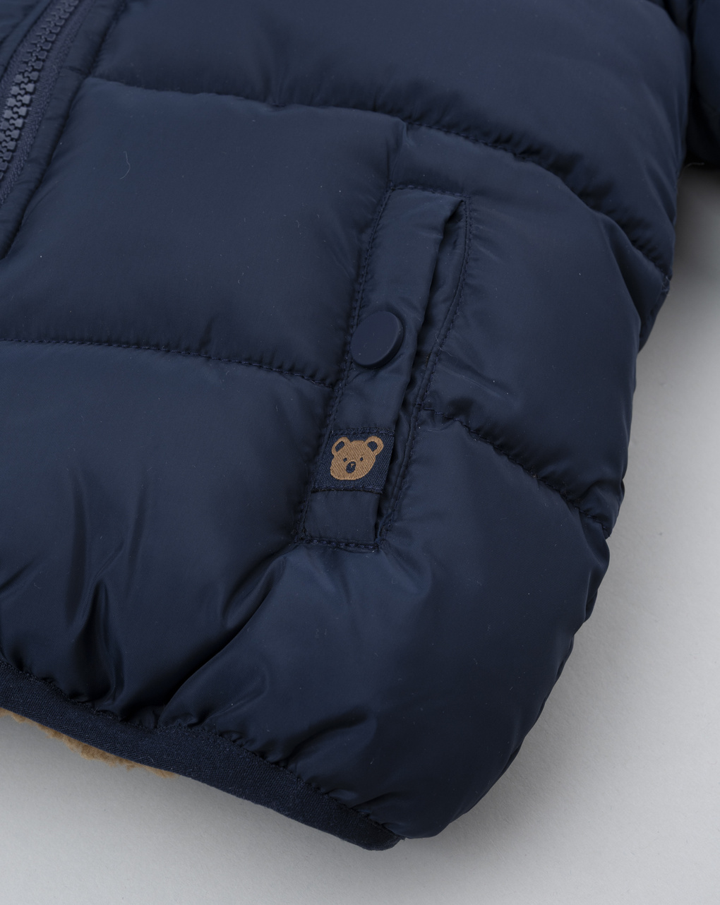 Piumino bimbo blu finto pelo