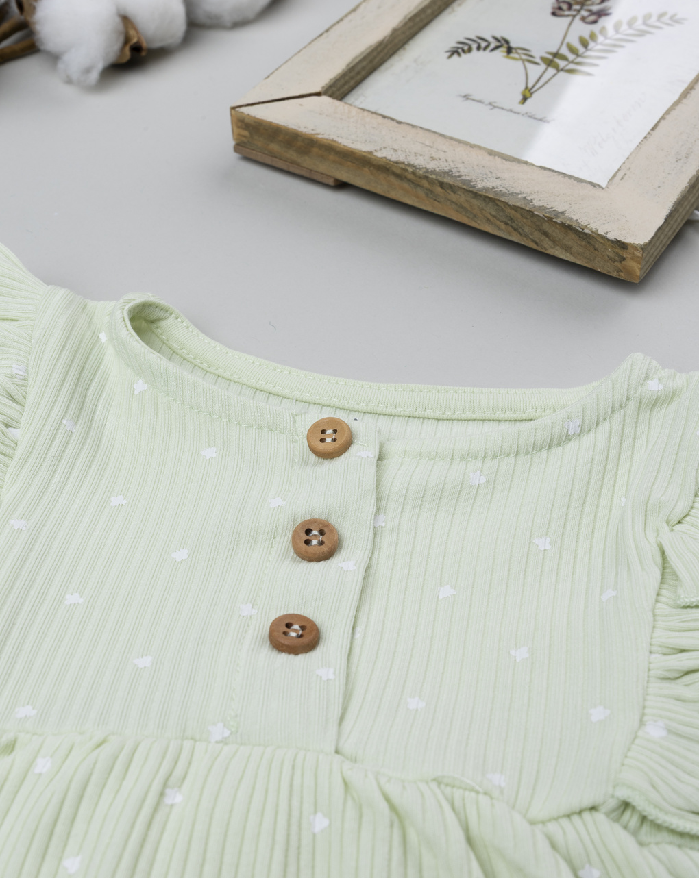 Pagliaccetto neonata verde con frill