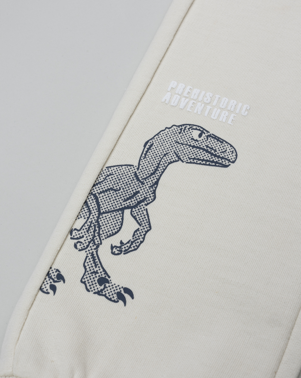 Pantalone bambino beige stampa rilievo