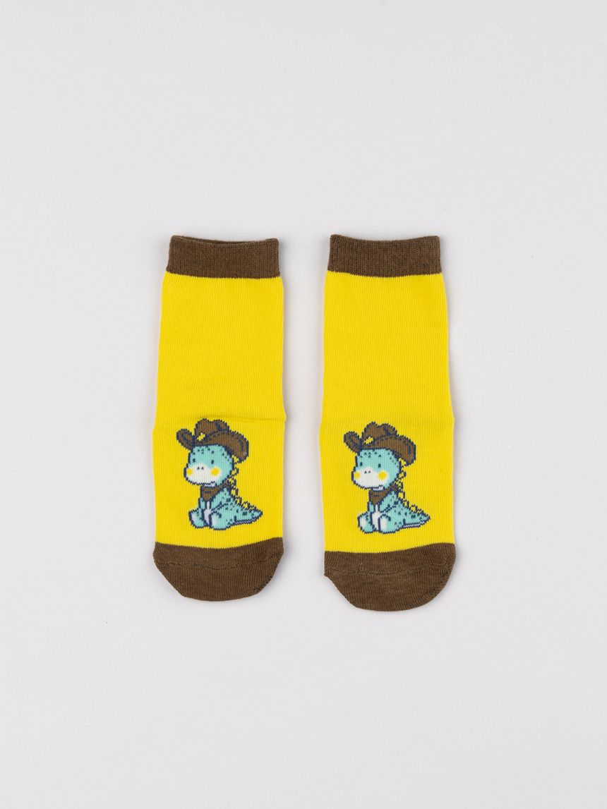 Antiscivolo bimbo giallo con dinosauro cowboy