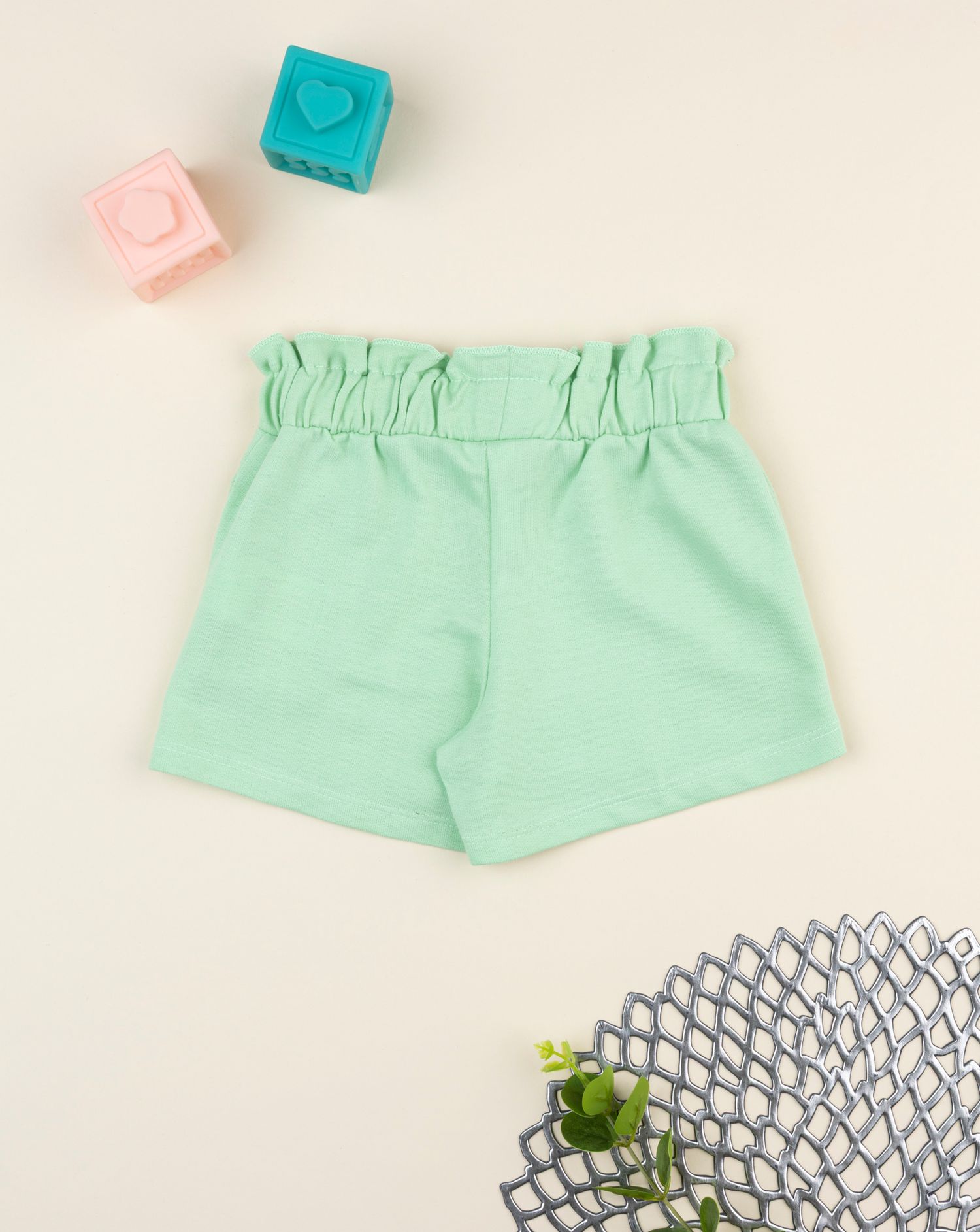 Shorts bimba verde con stampa