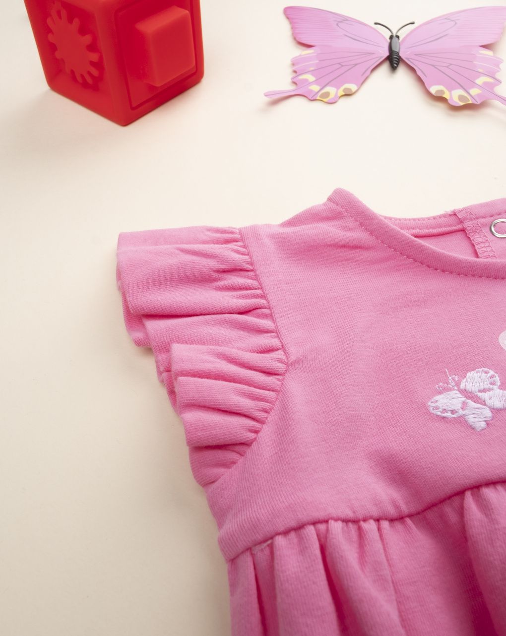 Pagliaccetto bimba rosa farfalle bianche