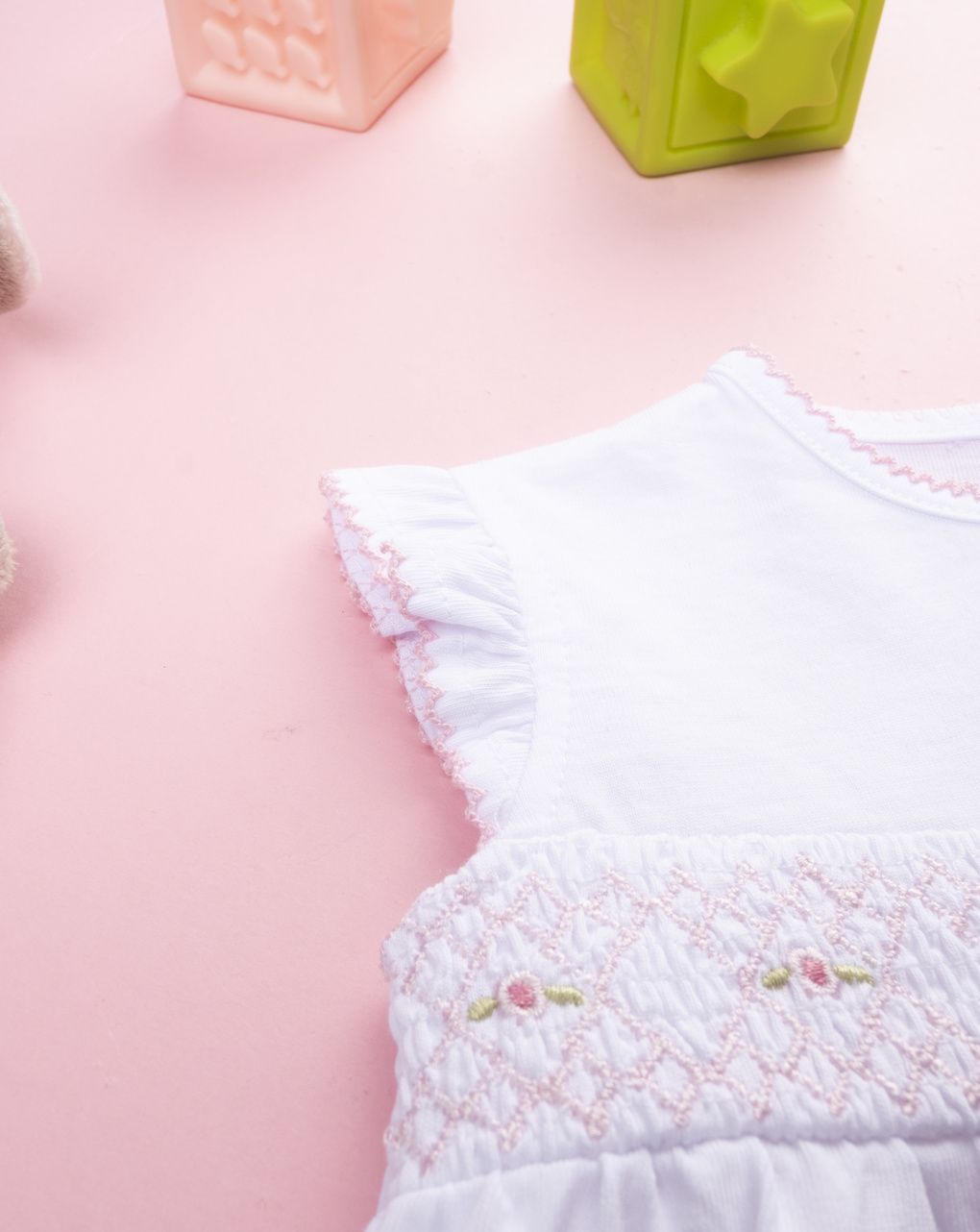 Pagliaccetto bimba bianco con greca