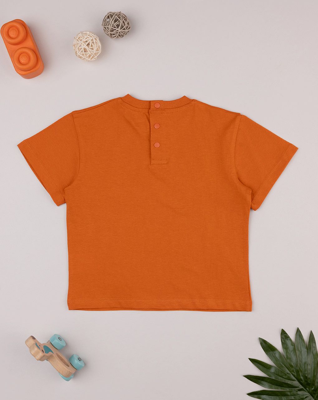 T-shirt bimbo arancione stampa triceratopo