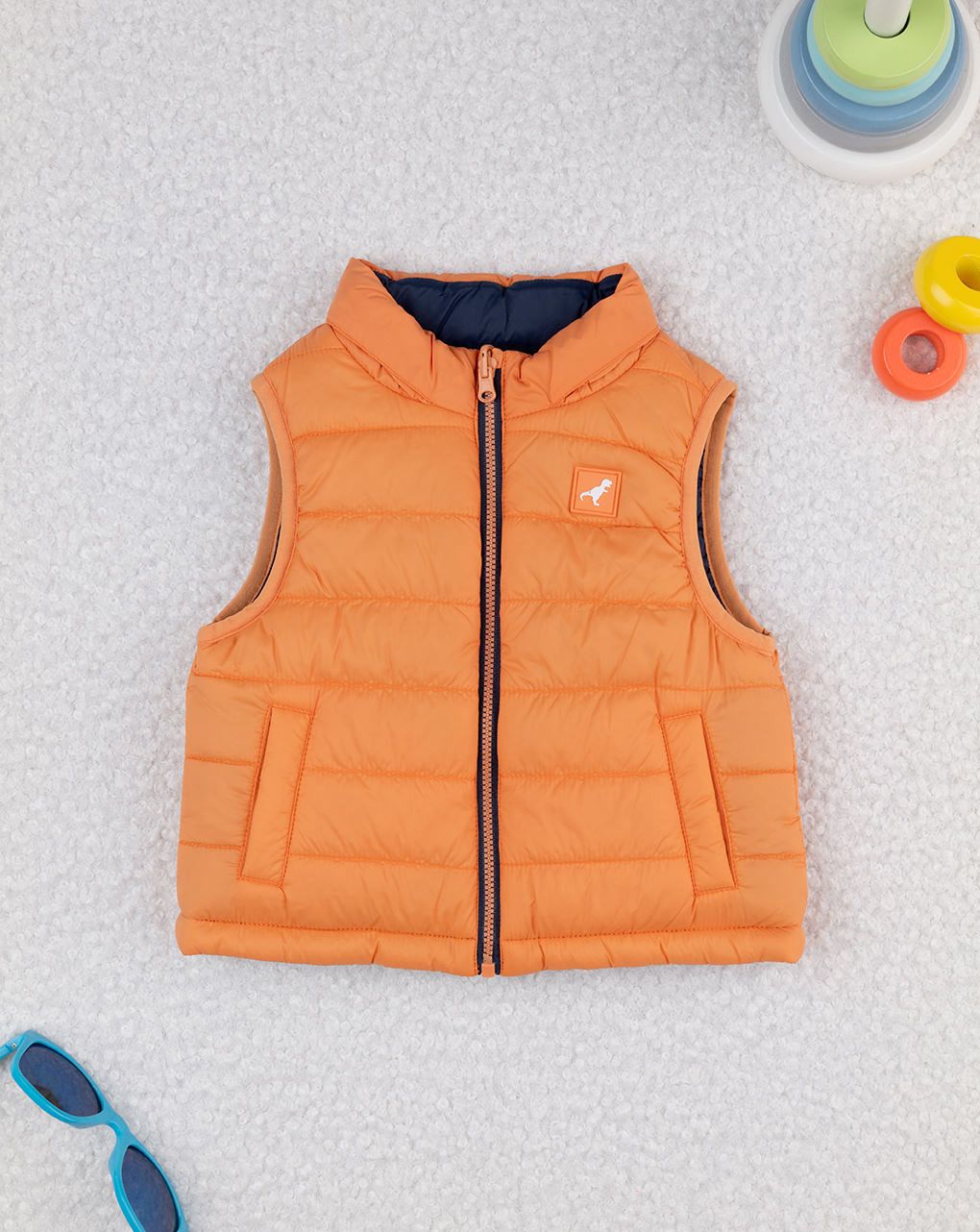 Piumino smanicato bimbo arancione