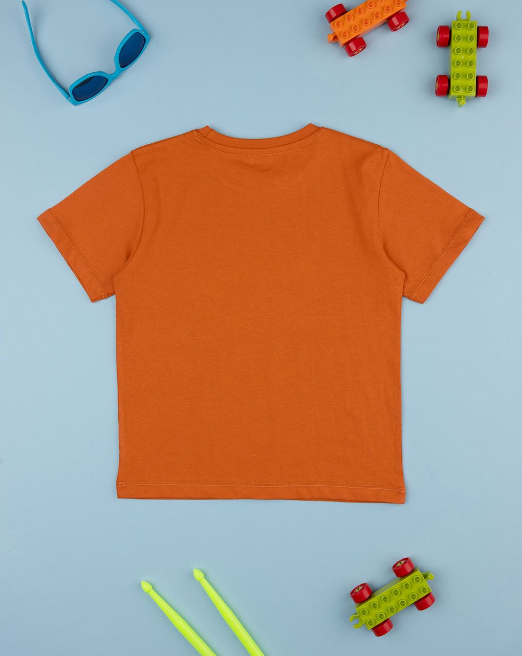 T-shirt bimbo arancione stampata dinosauri