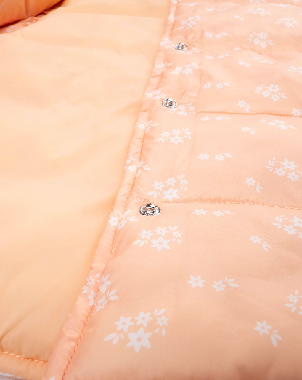 Piumino smanicato bimba arancione