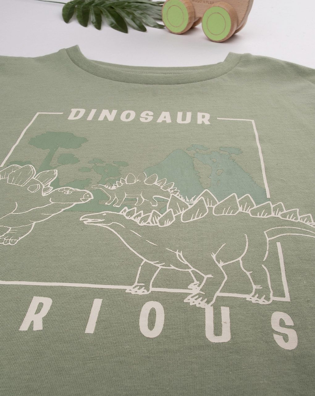 T-shirt bambino verde dinosauri
