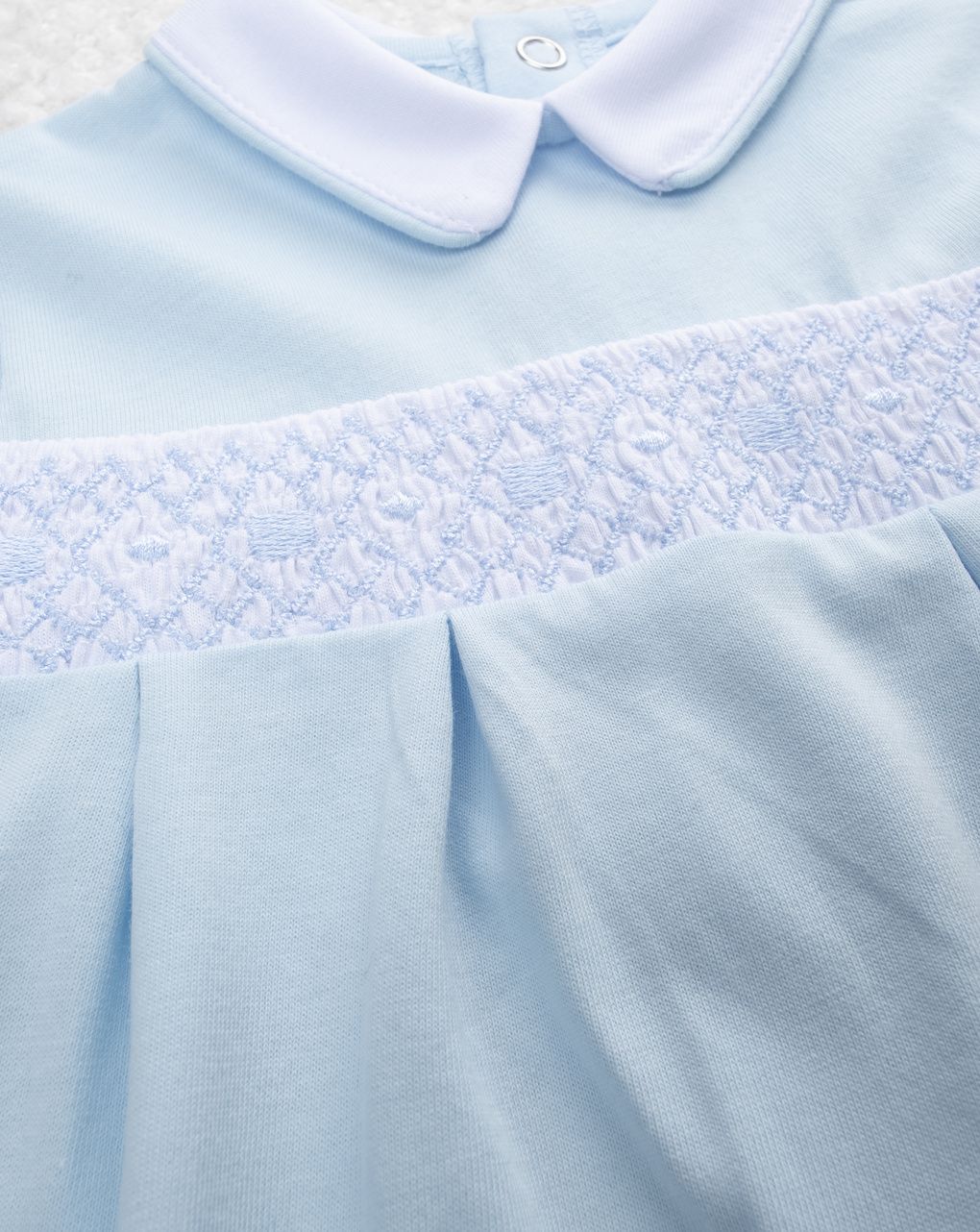 Pagliaccetto bimbo azzurro con ricami