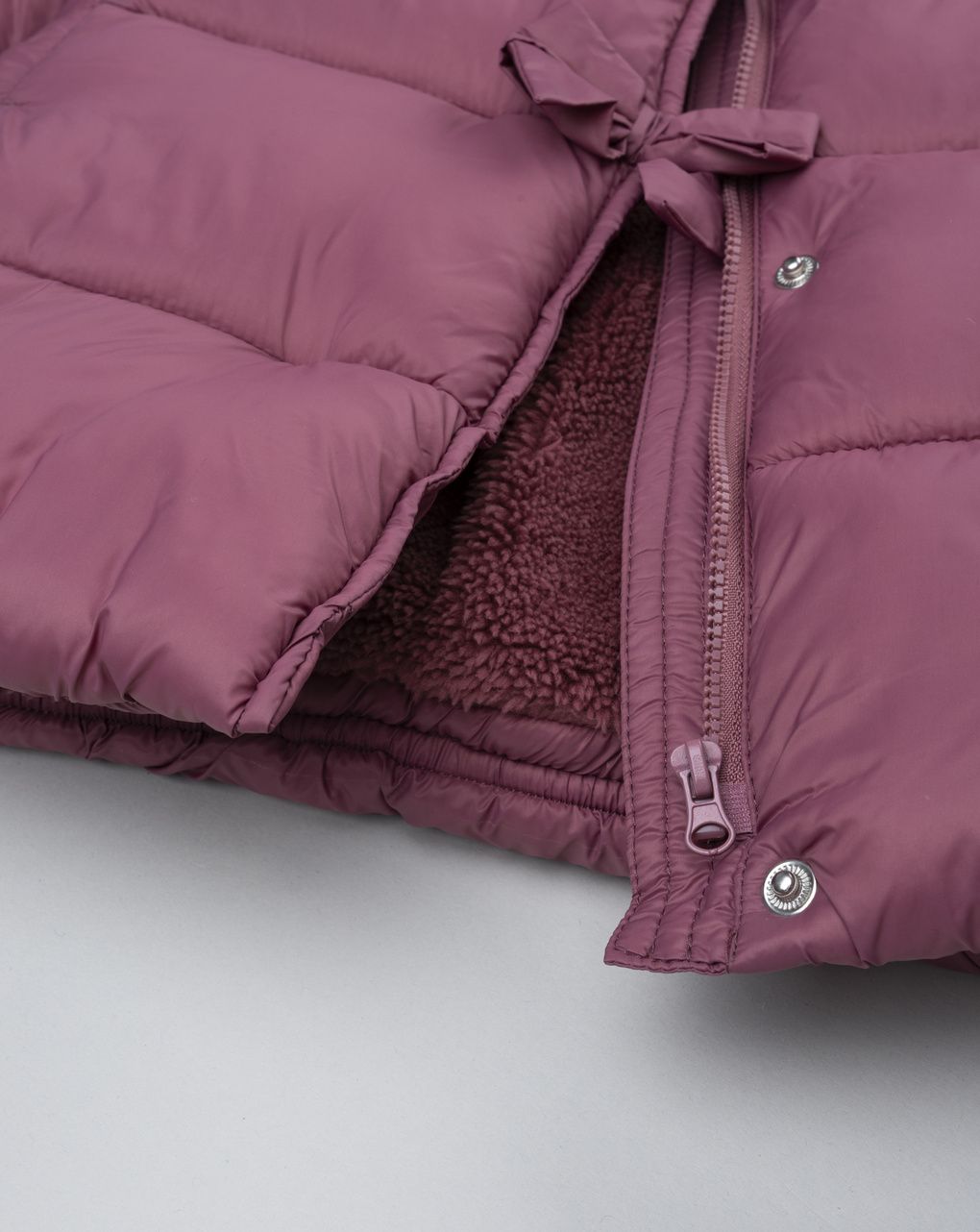 Piumino bimba rosa scuro fiocchi