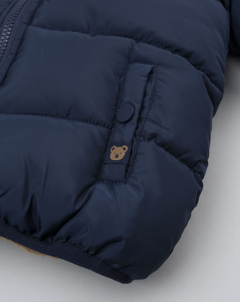 Piumino bimbo blu finto pelo