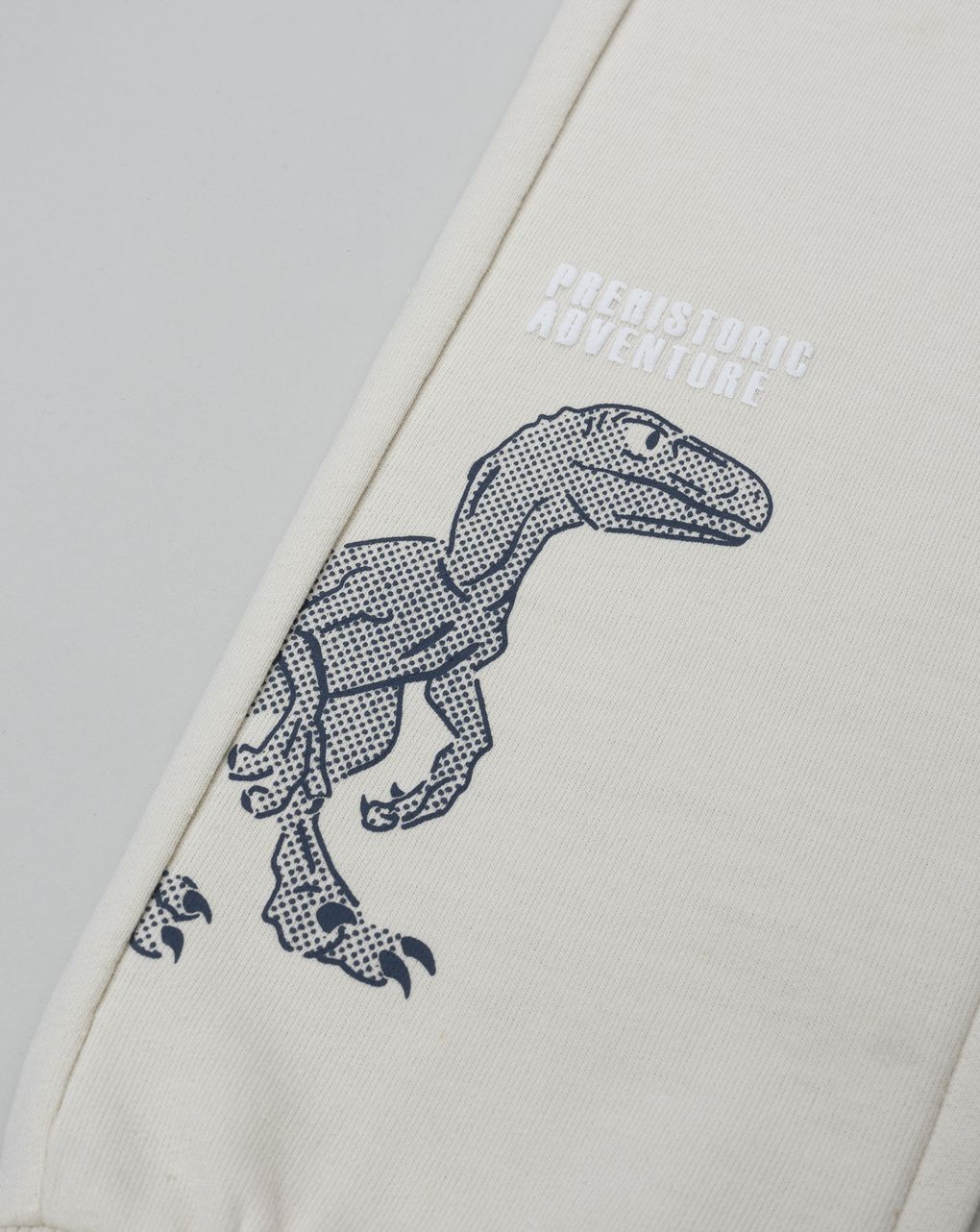 Pantalone bambino beige stampa rilievo