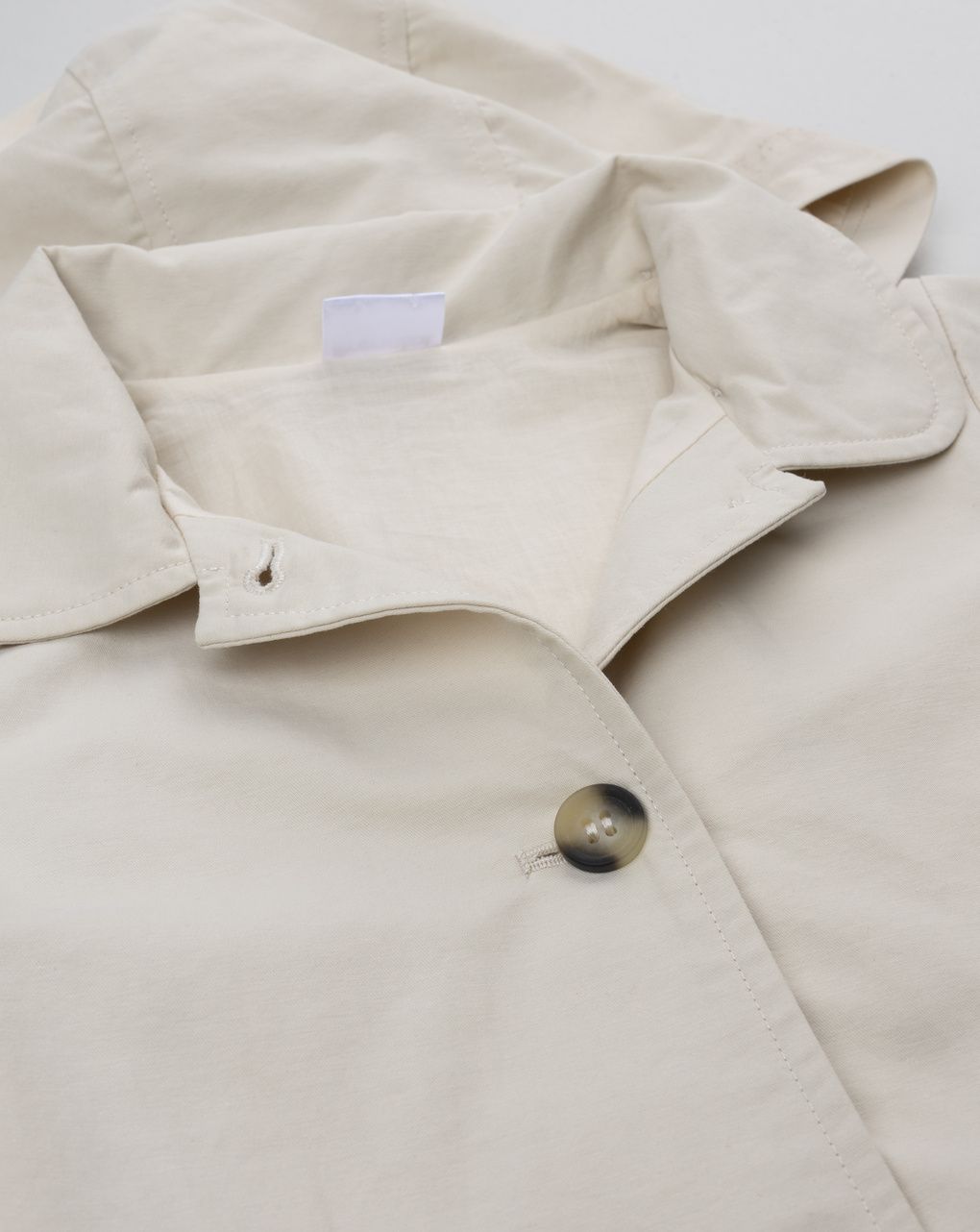 Trench bimba beige con cappuccio