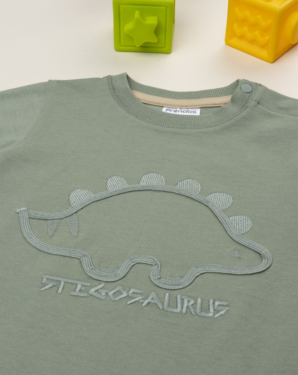 T-shirt bimbo verde stegosauro