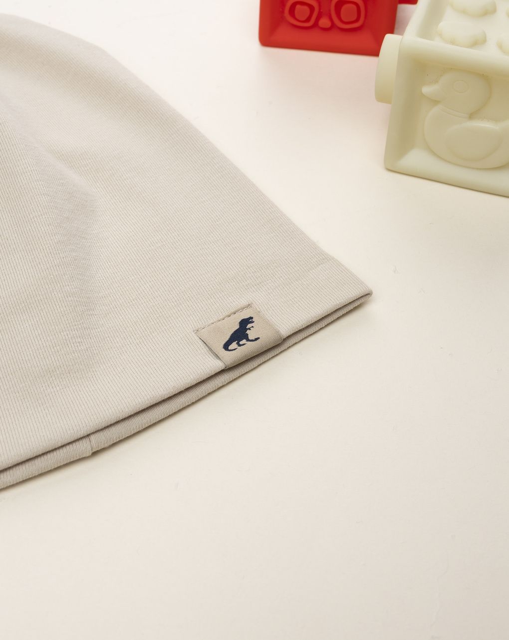 Berretto bambino beige patch dinosauro