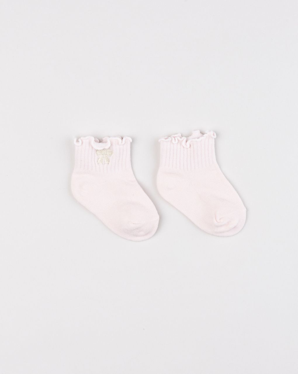 Calzini neonata rosa con bordo ondulato e fiocco