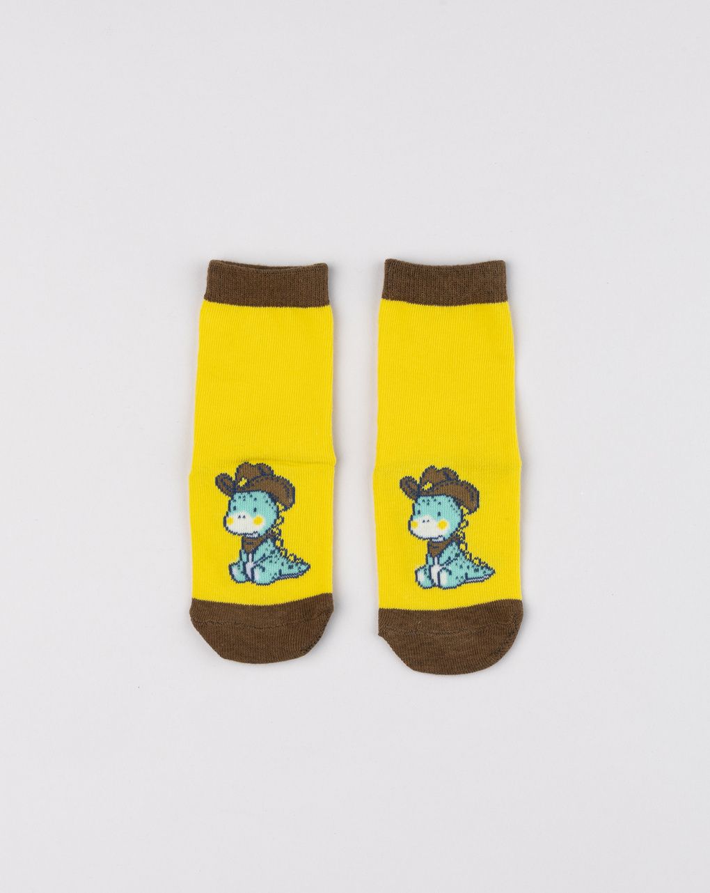 Antiscivolo bimbo giallo con dinosauro cowboy