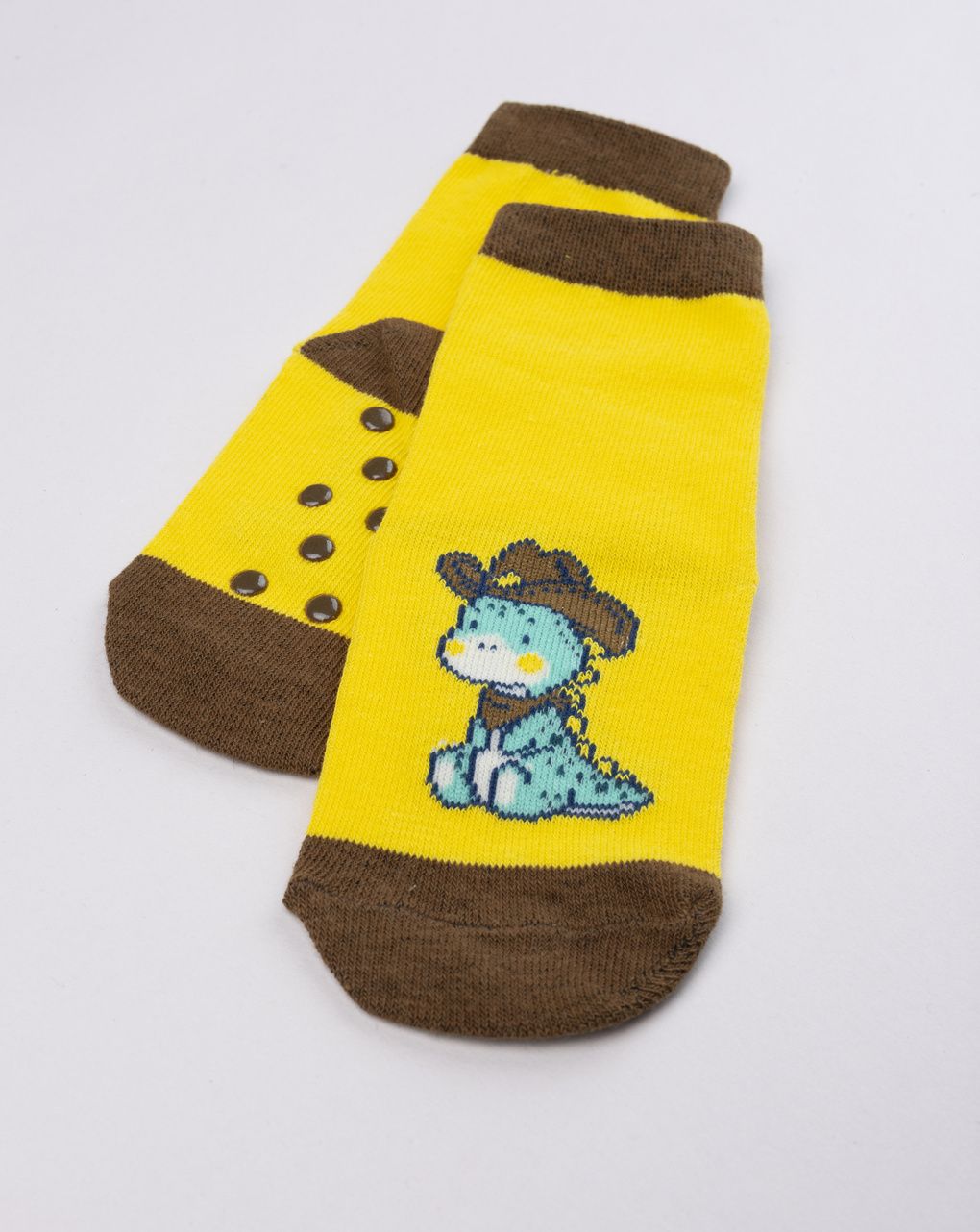 Antiscivolo bimbo giallo con dinosauro cowboy
