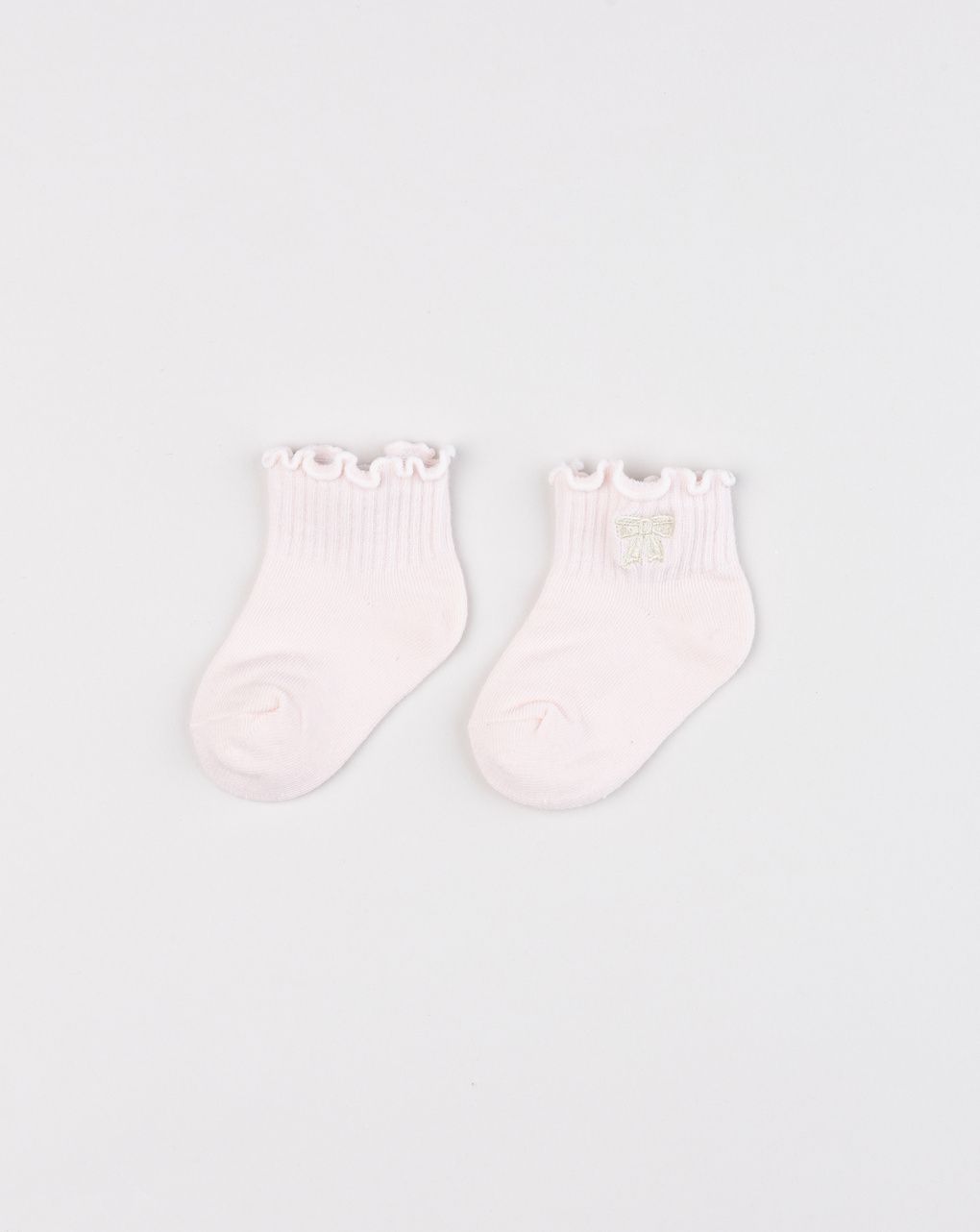 Calzini neonata rosa con bordo ondulato e fiocco