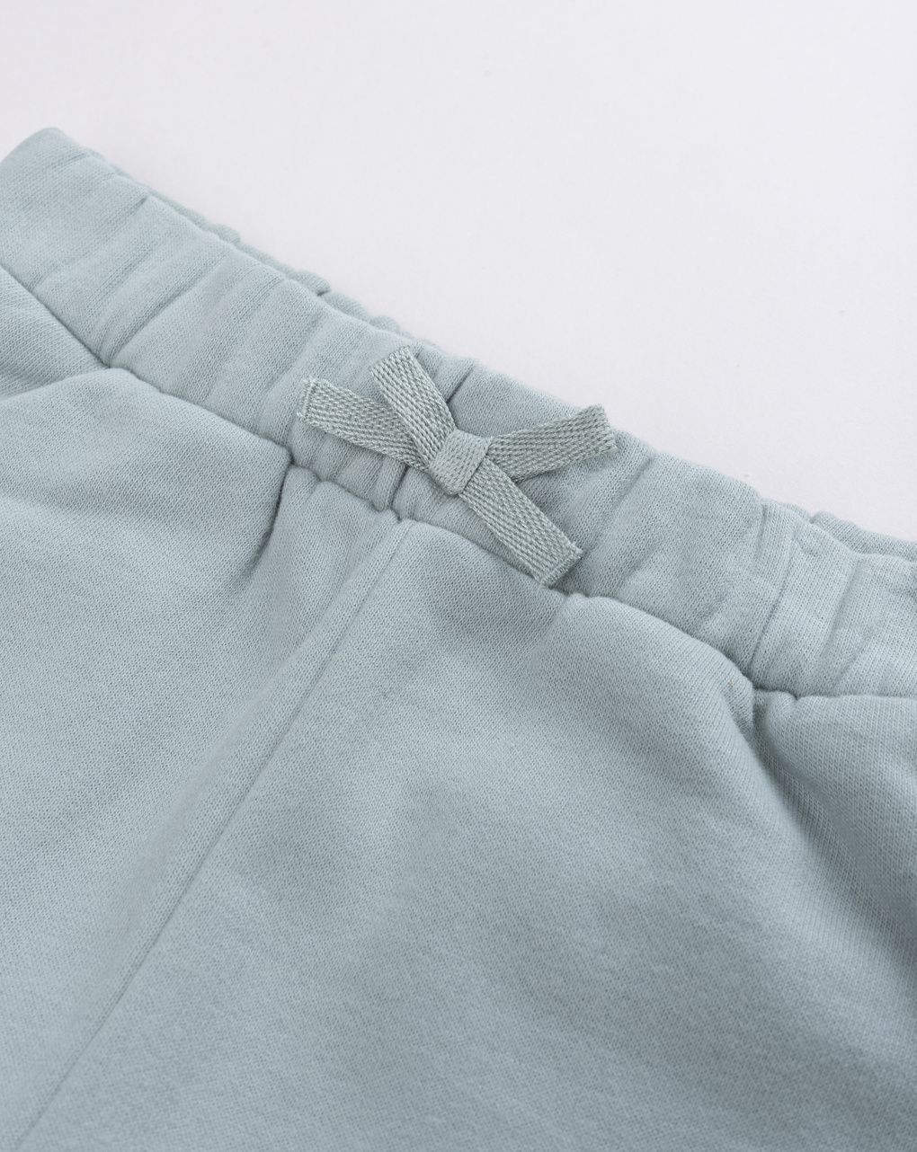 Pantalone felpato bimba verde salvia con fiocco