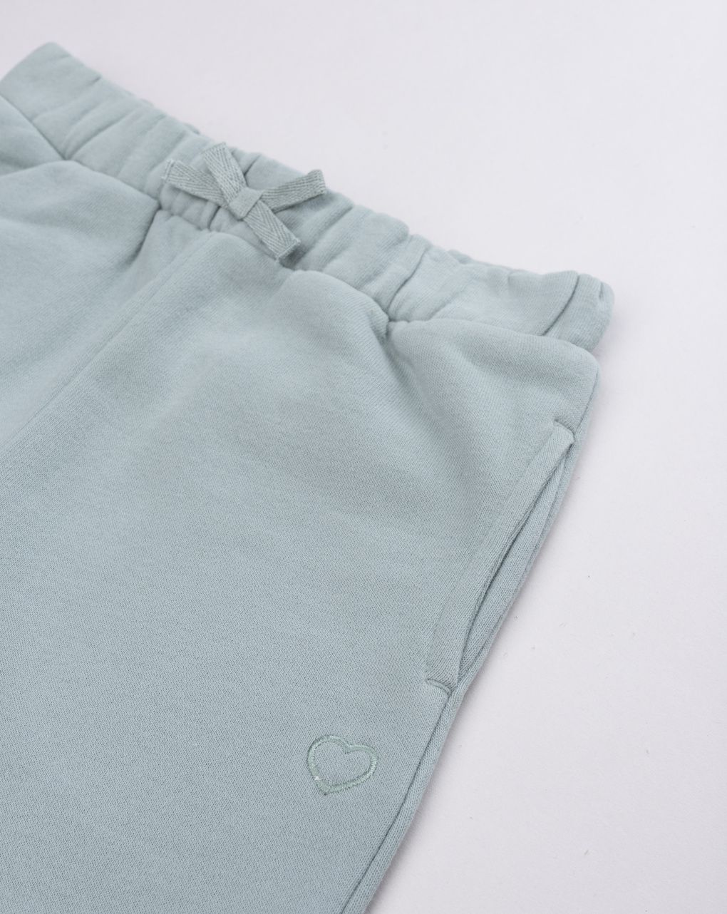 Pantalone felpato bimba verde salvia con fiocco