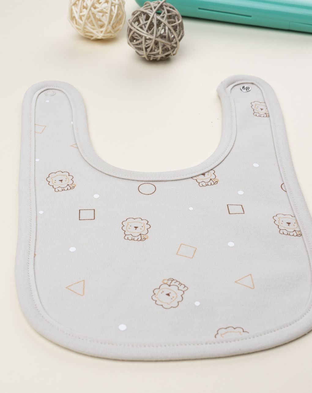 Bavaglino neonato beige leoni