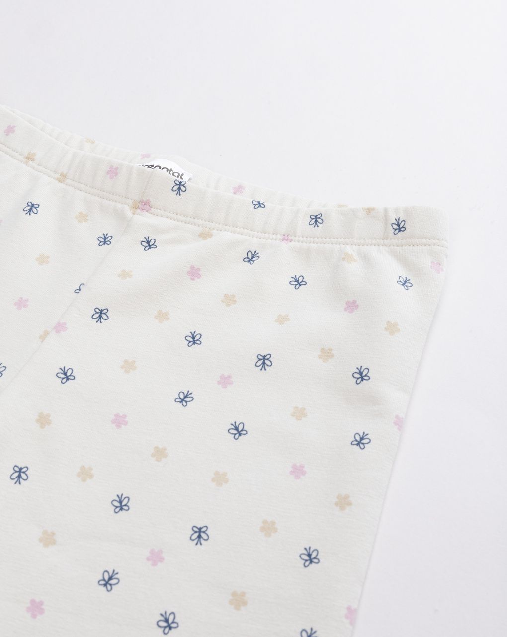 Leggings bimba beige garzati con allover blu e rosa