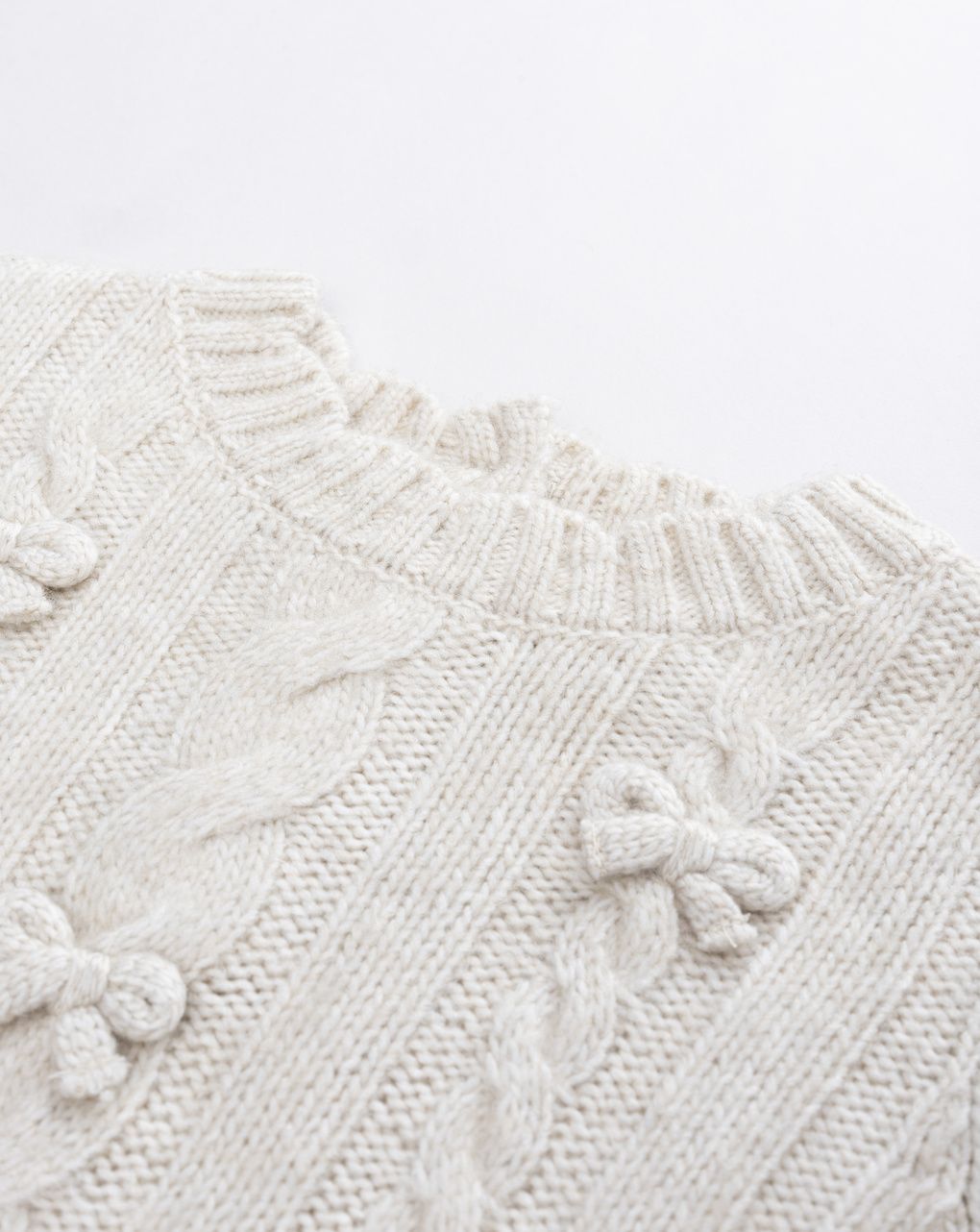 Maglione tricot bimba beige fiocchi