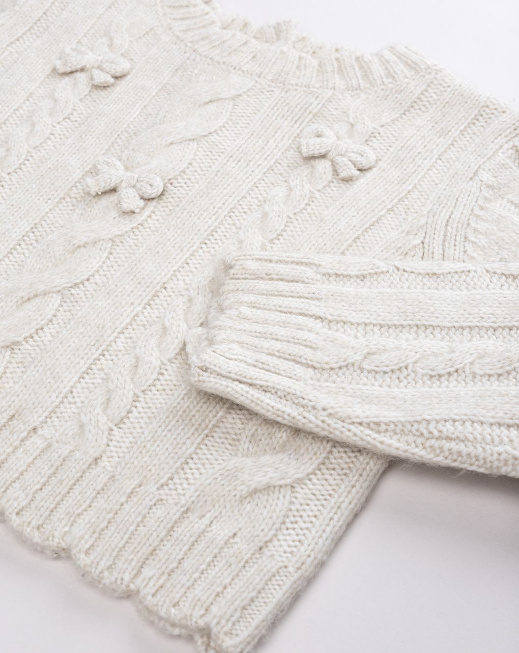 Maglione tricot bimba beige fiocchi