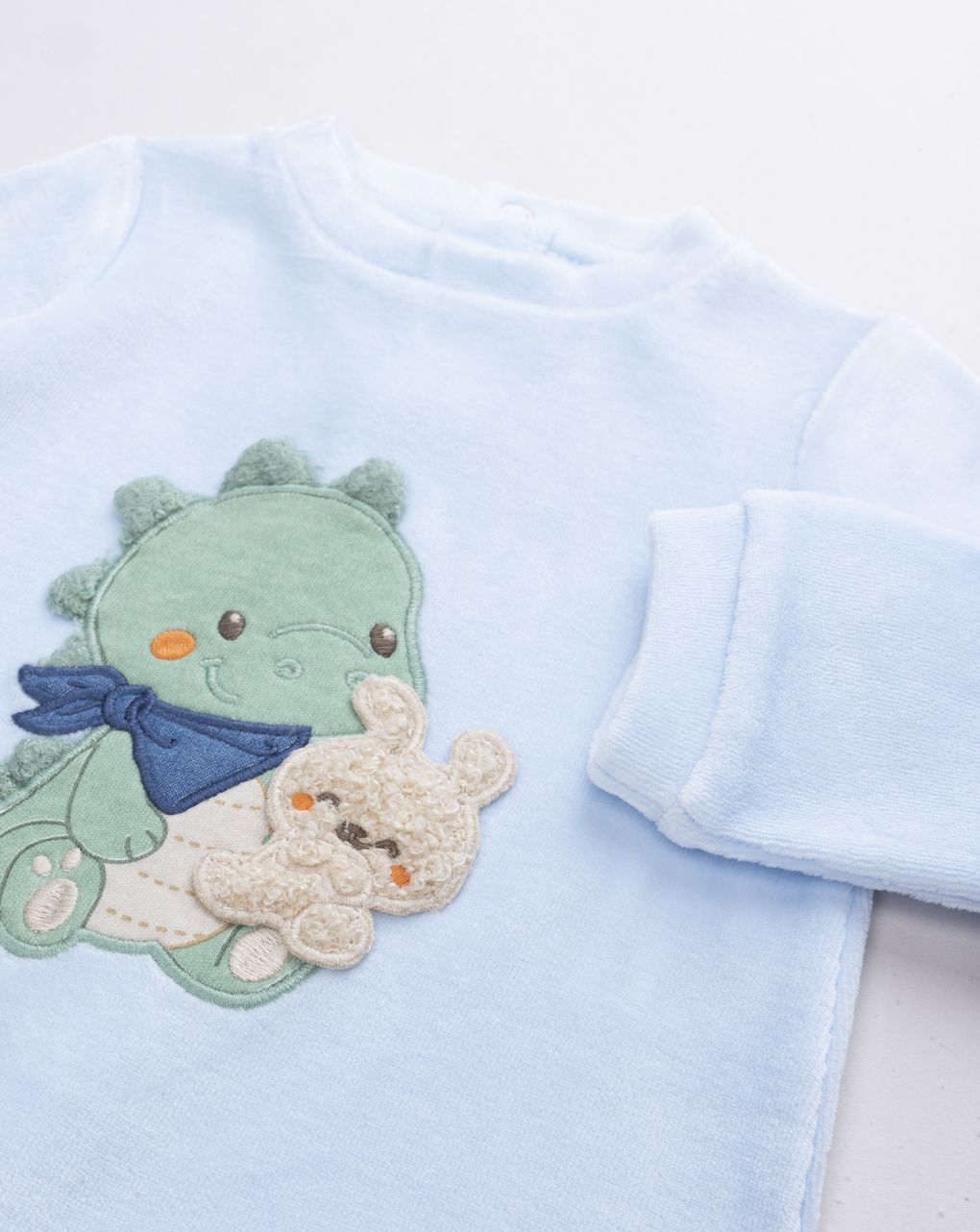 Tutina neonato azzurra in ciniglia draghetto