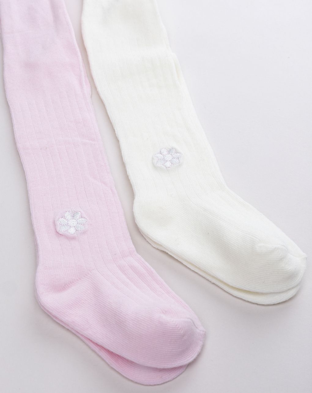 Collant bimba rosa e panna con ricamo