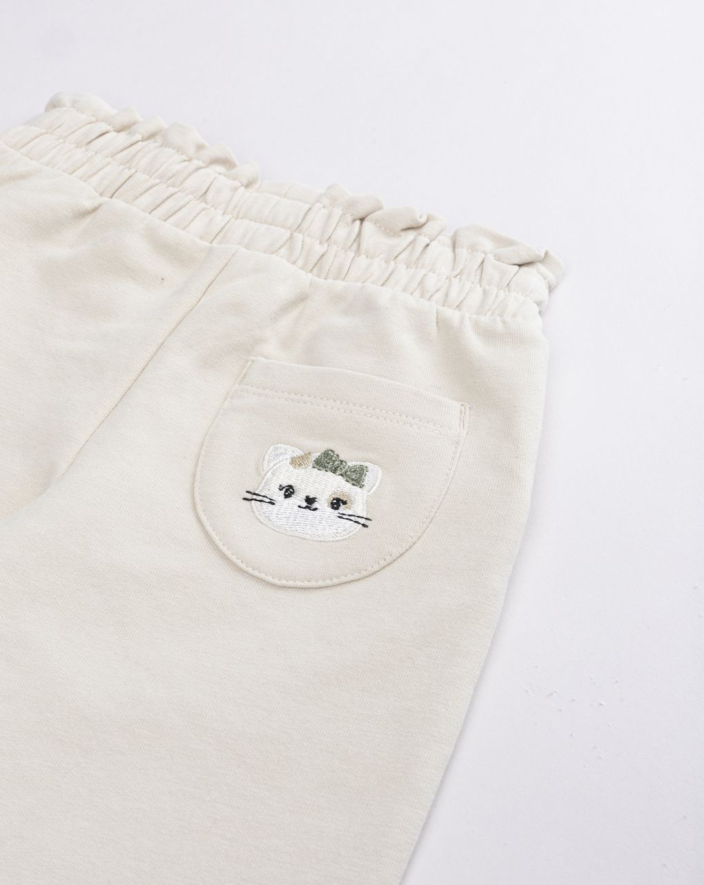 Pantaloni little wild con volto di gatto e fiocco ecru bimba