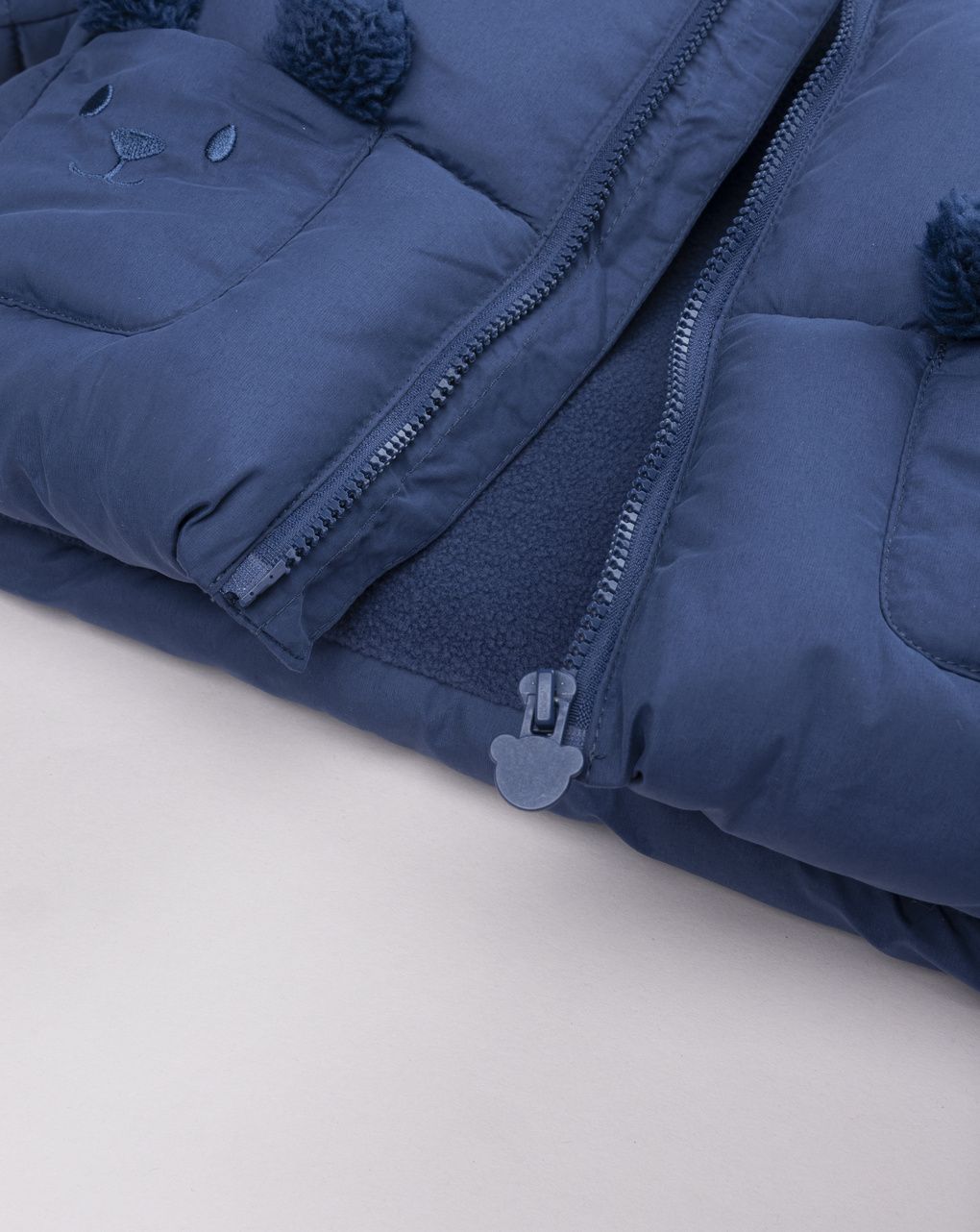 Giubotto neonato blu con cappuccio e tasche