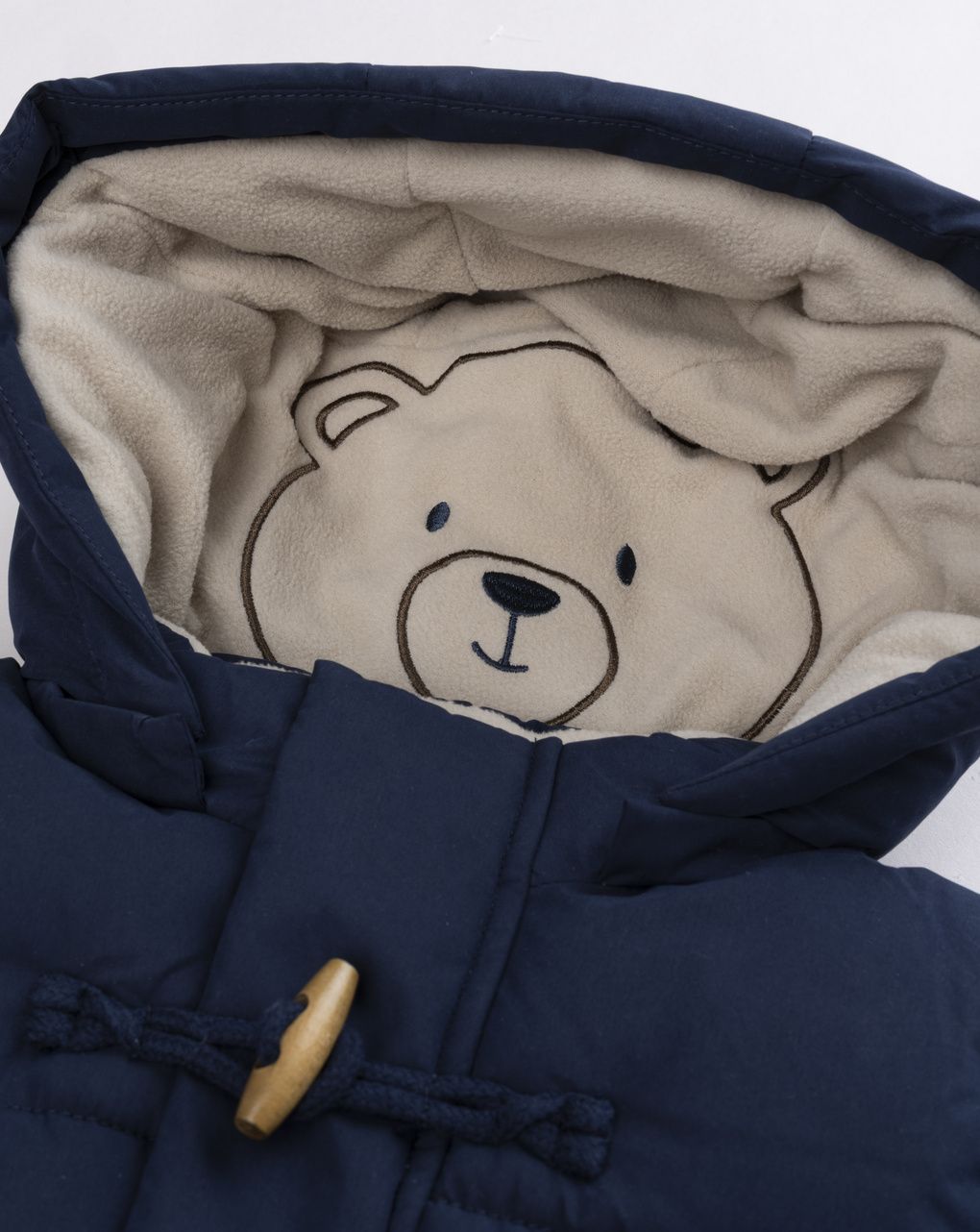 Piumino bimbo imbottito blu notte con alamari e cappuccio orsetto